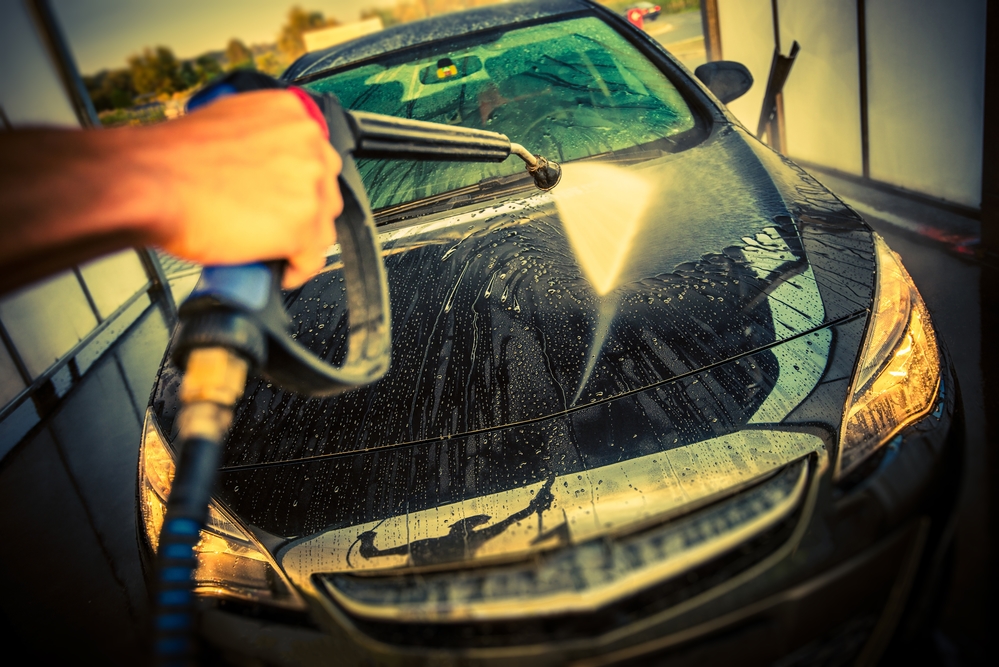 Car Cleaning in a Car Wash. High Pressure Car Washing. Taking Care of a Car.
