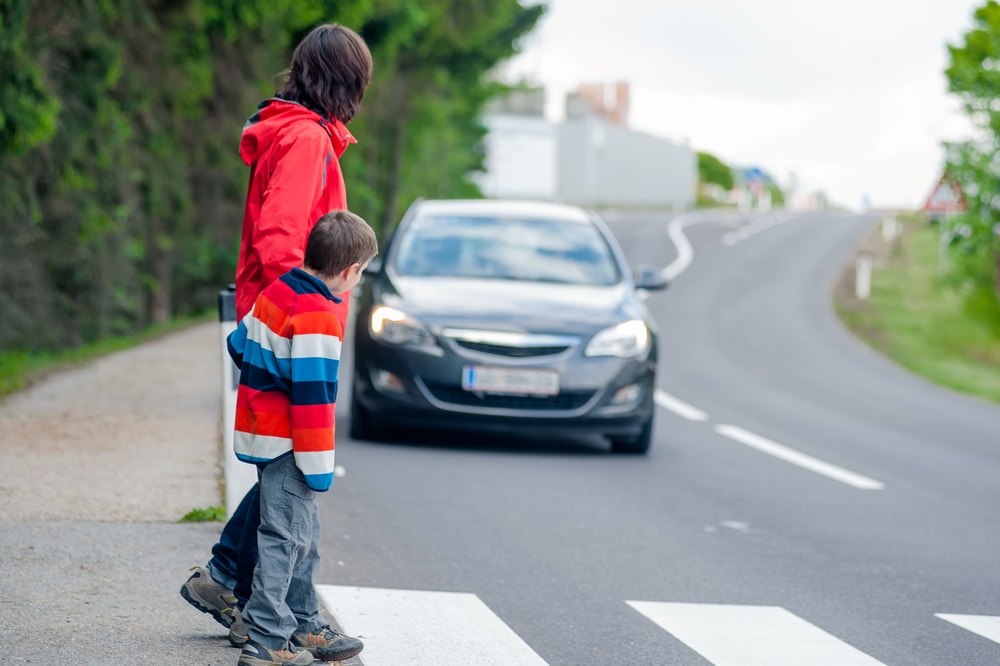 mother and child crossing the street